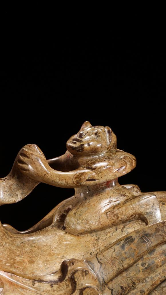 JUBAO HALL AUCTION HOUSE INCPre-Ming Dynasty Feathered Man Taming a Beast