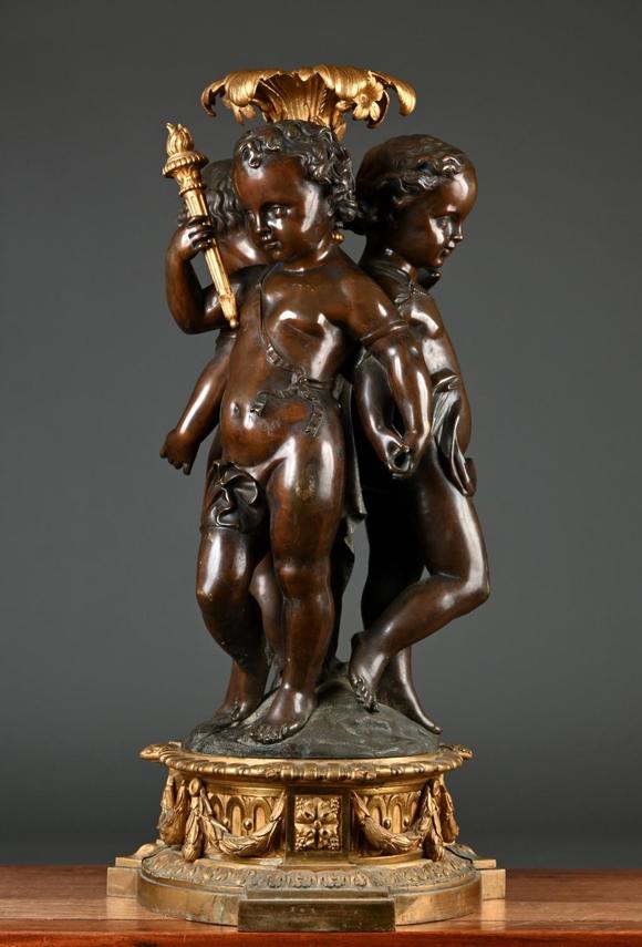 Loeckx AuctioneersA large and fine ornament in bronze \'three putti\',…