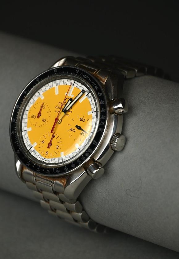 Loeckx AuctioneersOmega Speedmaster \'Schumacher\' with yellow dial, a…