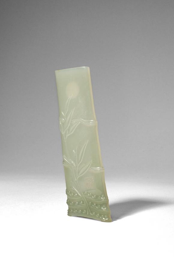 Apollo Art AuctionsQing Dynasty, Ca. AD 1644 - 1912. >
A carved celadon jade brush rest in the form of a naturalisti