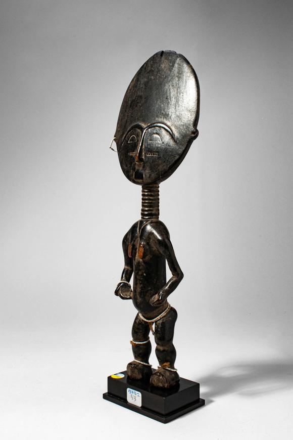 Apollo Art AuctionsCa. late 19th - early 20th century AD. >
A stylised female figure with a large disc-shaped head,