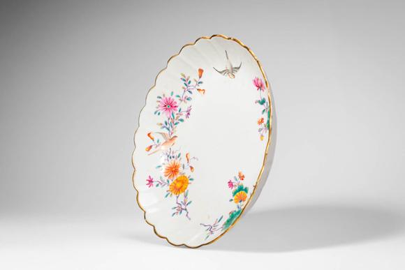 Apollo Art AuctionsMid Qing Dynasty, Ca. 18th century AD. >A famille rose porcelain dish of shallow, lobed form with