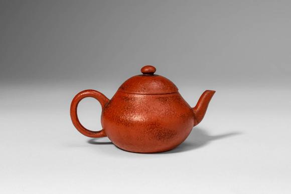 Apollo Art AuctionsQing Dynasty, Ca. AD 1644 - 1912. >A Yixing stoneware teapot of compact, globular form, the round