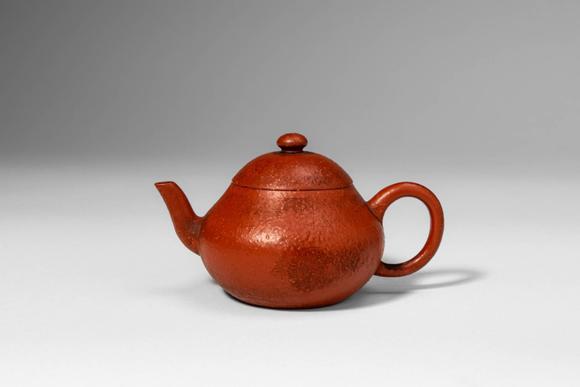 Apollo Art AuctionsQing Dynasty, Ca. AD 1644 - 1912. >A Yixing stoneware teapot of compact, globular form, the round