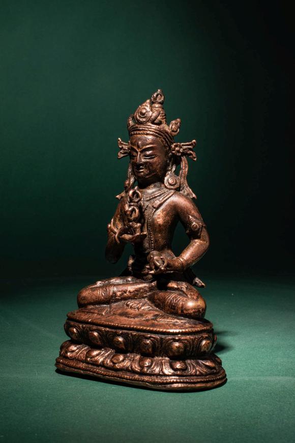 Apollo Art AuctionsCa. 14th century AD. >
A beautiful cast gilt copper alloy figure of Vajrasattva, seated in vajrap