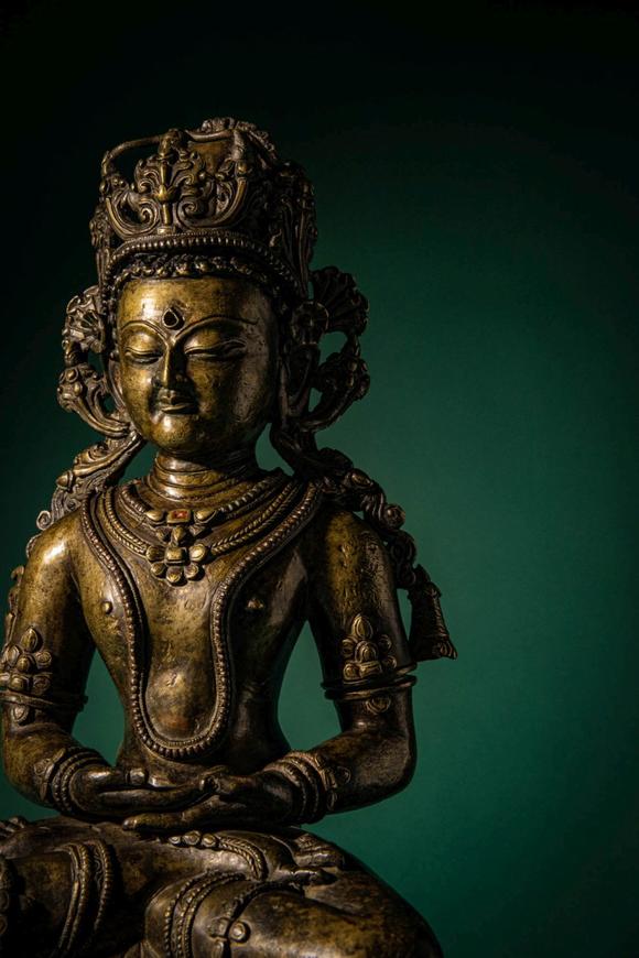Apollo Art AuctionsCa. 14th century AD. >
A finely cast copper alloy figure depicting Kunzang Akor, seated in serene