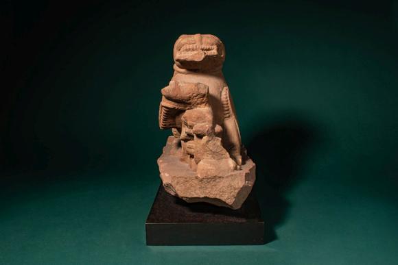 Apollo Art AuctionsCa. 11th - 12th century AD. >
A carved sandstone sculpture depicting a recumbent lion, shown with