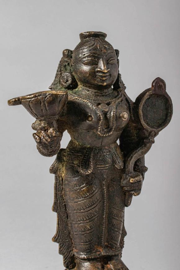 Apollo Art AuctionsCa. 14th-15th century AD. A bronze oil lamp cast in the form of Goddess Lakshmi, the consort of V