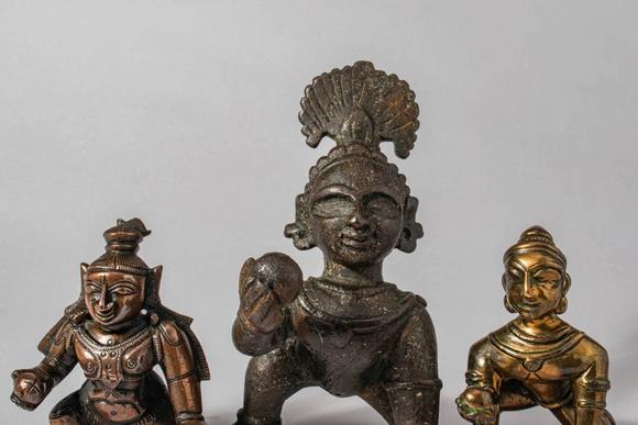 Apollo Art AuctionsCa. 12th-19th century AD. A group of three bronze figures of Krishna as the Butter Thief, each de
