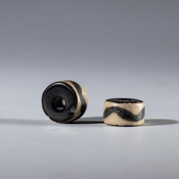 Bertolami Fine ArtA pair of ornamental agate beads with a chevron motif. China, 16th century.