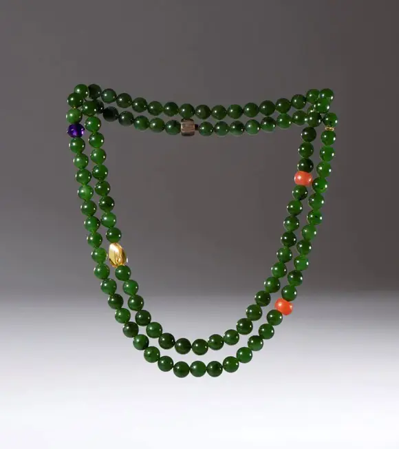 Bertolami Fine ArtMala composed of 108 green jade, carnelian, amethyst, smoky quartz, and citrine beads. China, Qing Dynasty (1644-1912), 19th century.