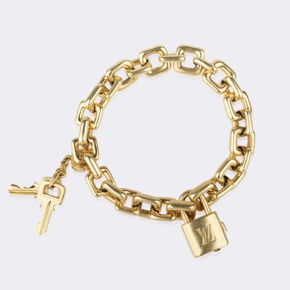 Auktionshaus StahlLouis Vuitton. 'Padlock and Key' Charm Gold Bracelet.