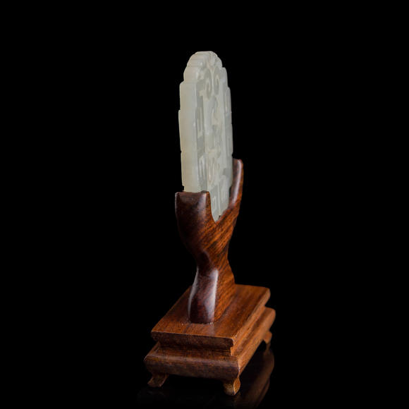 Oakridge Auction Gallery十八世紀(jì) 白玉鏤雕鸚鵡佩（附木座）  A Chinese reticulated white jade 'parrot' plaque