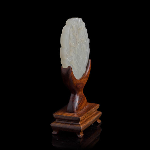 Oakridge Auction Gallery十九世紀(jì)早 白玉鏤雕童子佩（附木座）  A Chinese reticulated white jade 'boy' plaque