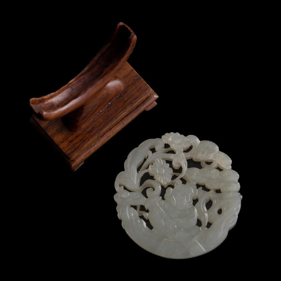 Oakridge Auction Gallery十九世紀(jì)早 白玉鏤雕童子佩（附木座）  A Chinese reticulated white jade 'boy' plaque