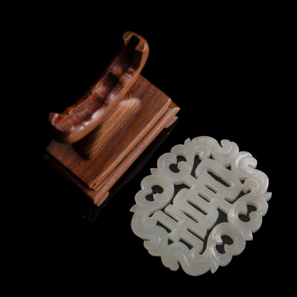 Oakridge Auction Gallery十九世紀早 白玉鏤雕喜字佩（附木座）  A Chinese reticulated white jade 'happiness' plaque