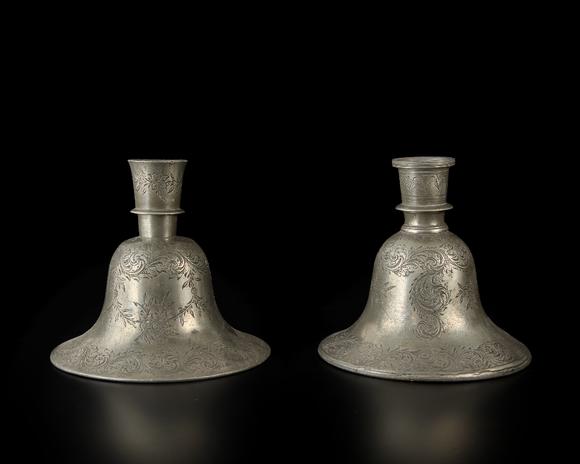 RoseberysA pair of engraved tinned bell-shaped huqqa bases in the European taste,?
India, late 19th century,?

the decoration consisting of exuberant leaf