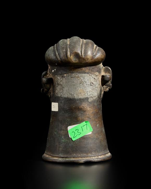RoseberysA small brass Shiva lingam cover,?
Western Deccan, 19th century,?

with almond bulging eyes under marked eyebrows, his full lips under a serpenti