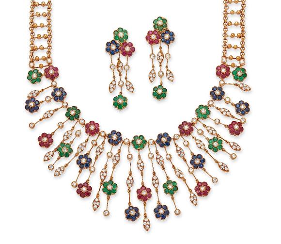 RoseberysA gem-set floral necklace and earring set, the fringe necklace composed of graduated drops, each with floral cluster panels, set with a brilliant-cut