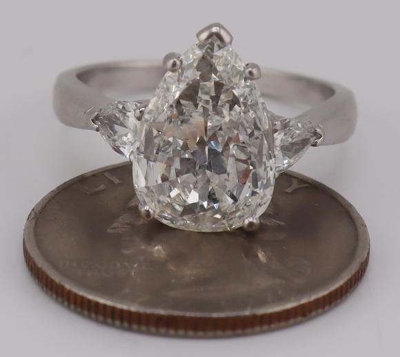 Clarke Auction GalleryJEWELRY. Platinum and 3.59ct Pear Diamond Ring.