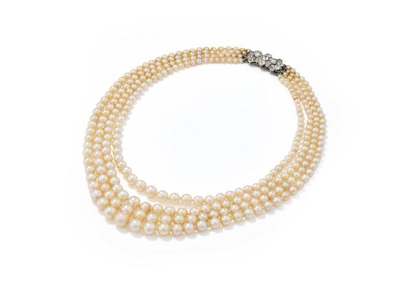 DreweattsAN EARLY 20TH CENTURY FOUR ROW NATURAL PEARL AND DIAMOND NECKLACE