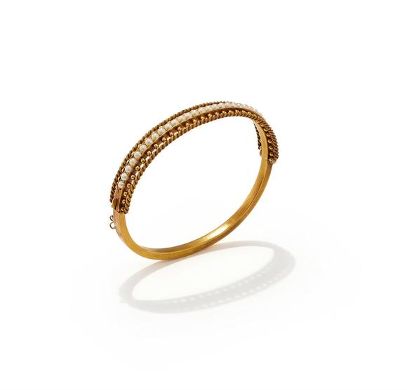 DreweattsAN EARLY 20TH CENTURY HALF PEARL BANGLE