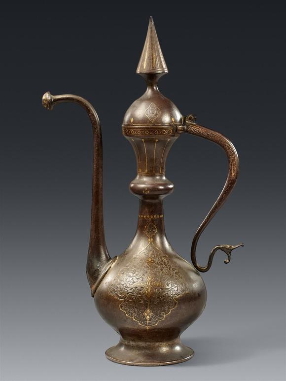 Kunsthaus Lempertz KGAn elegant Qajar gold damascened steel ewer. 19th century