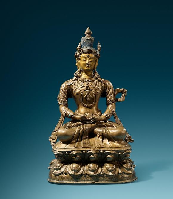 Kunsthaus Lempertz KGA rare Tibetan brass figure of Sarvavid Vairocana. Partially cold-gild and polychrome. 16/17th century