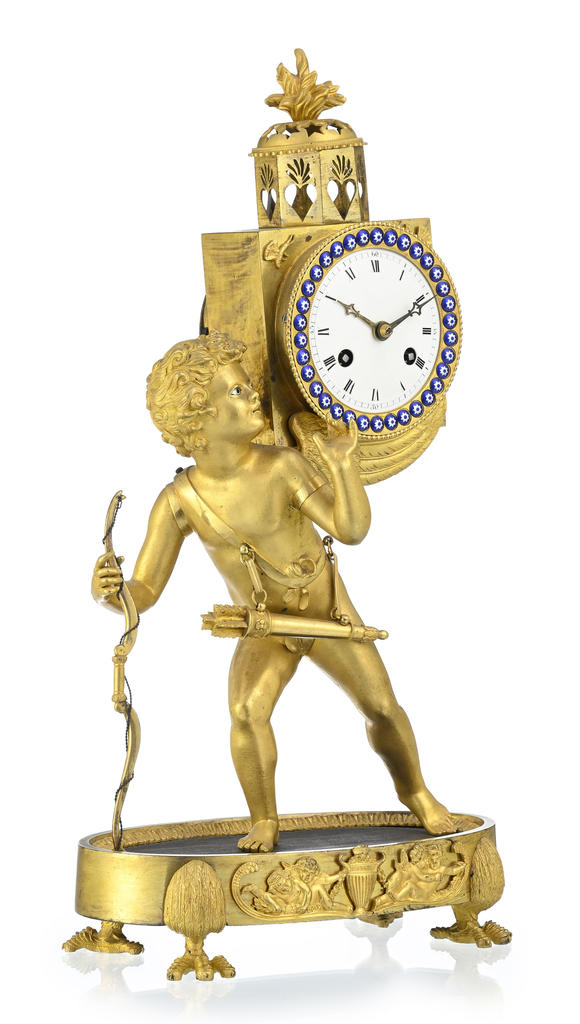 Piguet - H?tel des VentesPendule dite à lanterne magique d'époque Restauration, en bronze doré et finement ciselé, 47x25x14 cm