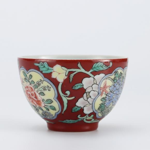 KARSON AUCTIONQing Dynasty Yongzheng period, Foreign-color enameled cup with red ground and reserved floral panels