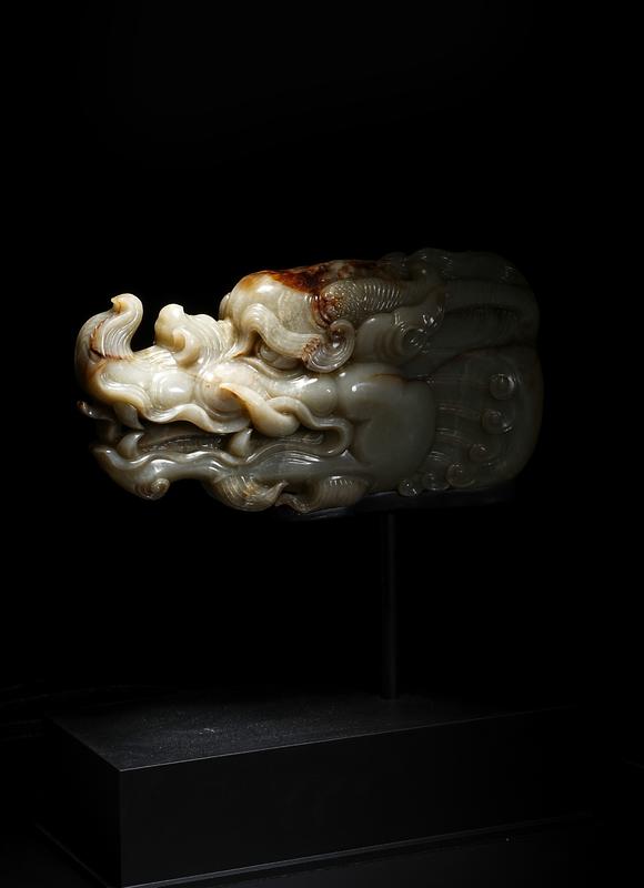 HUNG YUN ZHAI AUCTION HOUSE INCPre-Ming Dynasty or Earlier Hetian Jade Dragon-Head Ornament