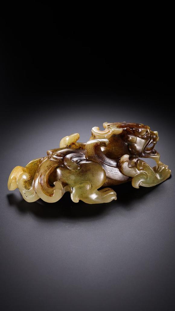 HUNG YUN ZHAI AUCTION HOUSE INCPre-Ming Dynasty Hetian Jade Auspicious Beast