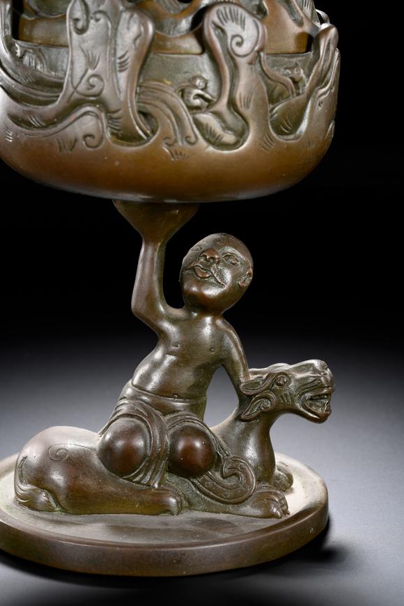 HUNG YUN ZHAI AUCTION HOUSE INCBronze Boshan Incense Burner with Central Asian (Hu) Figure Riding a Beast