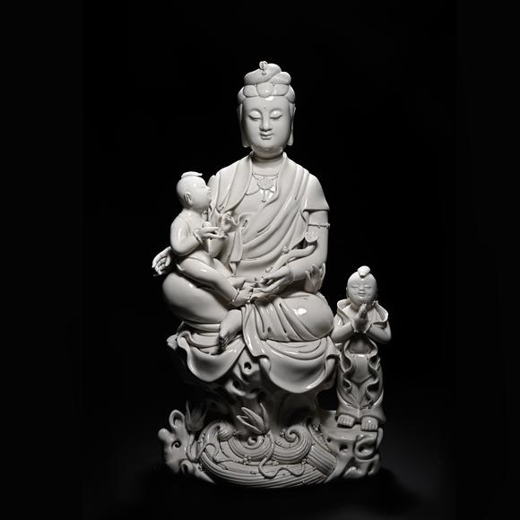 HUNG YUN ZHAI AUCTION HOUSE INCDehua White-Glazed Songzi Guanyin (Bestowing Children)
