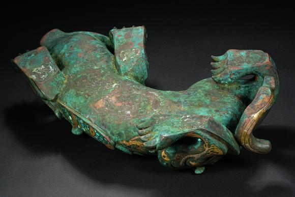 HUNG YUN ZHAI AUCTION HOUSE INCPre-Ming Dynasty Gold and Silver Inlaid Inscribed Mythical Beast