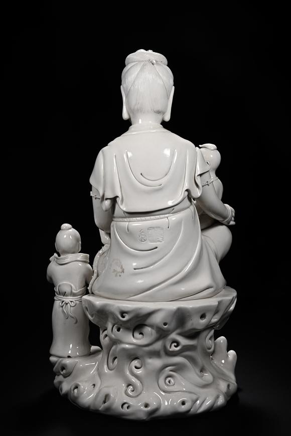 HUNG YUN ZHAI AUCTION HOUSE INCDehua White-Glazed Songzi Guanyin (Bestowing Children)