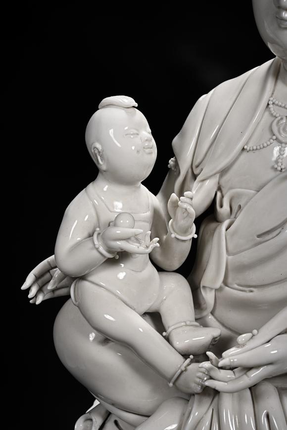 HUNG YUN ZHAI AUCTION HOUSE INCDehua White-Glazed Songzi Guanyin (Bestowing Children)