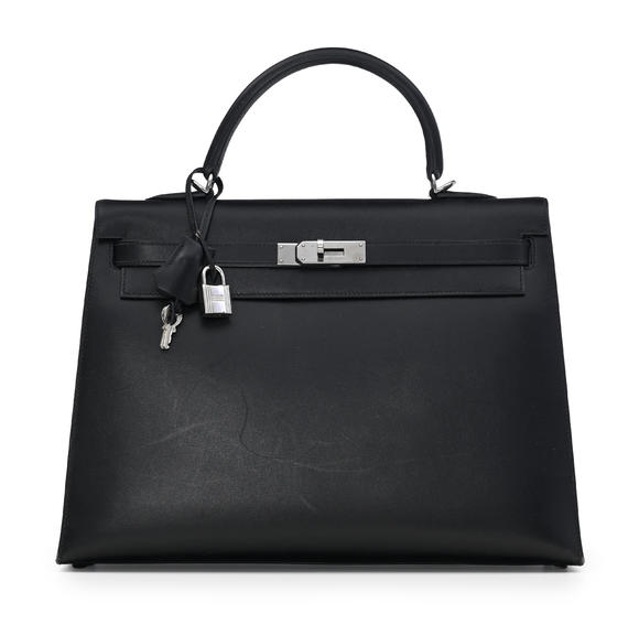 Piguet - H?tel des VentesHermès, sac Kelly 35 Sellier en cuir box noir, année 2004, bouclerie palladium, tirette et clochette avec 2 clefs et cadenas