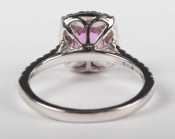 TooveysA platinum, pink sapphire and diamond cluster ring, claw set with th