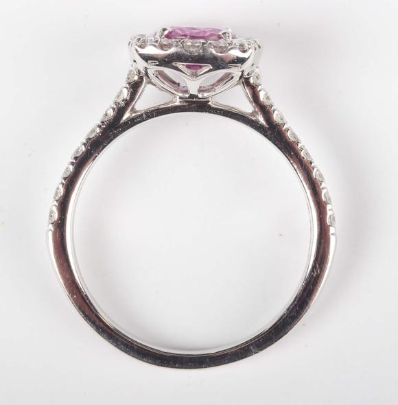 TooveysA platinum, pink sapphire and diamond cluster ring, claw set with th