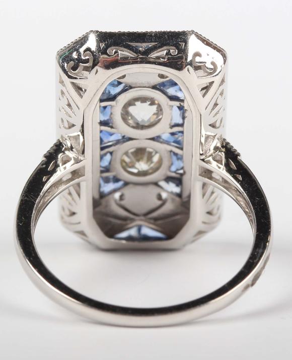 TooveysA platinum, sapphire and diamond panel ring in an Art Deco inspired
