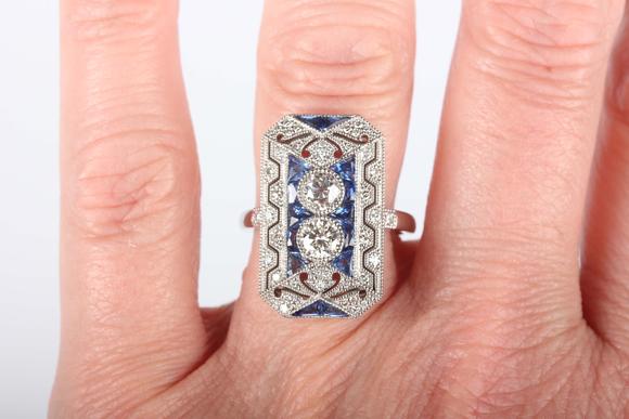 TooveysA platinum, sapphire and diamond panel ring in an Art Deco inspired