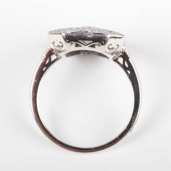 TooveysA platinum, sapphire and diamond panel ring in an Art Deco inspired