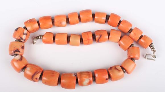 TooveysA single row necklace of graduated barrel form dyed coral beads, Nor
