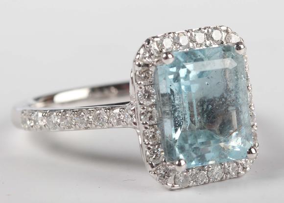 TooveysA platinum, aquamarine and diamond cluster ring, claw set with the c