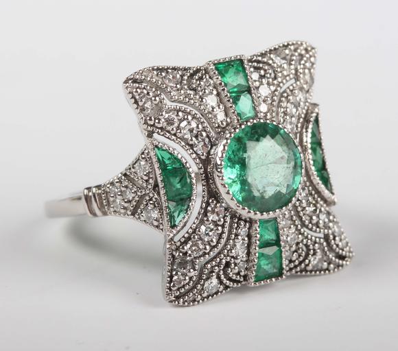 TooveysA platinum, emerald and diamond panel ring in an Art Deco inspired d