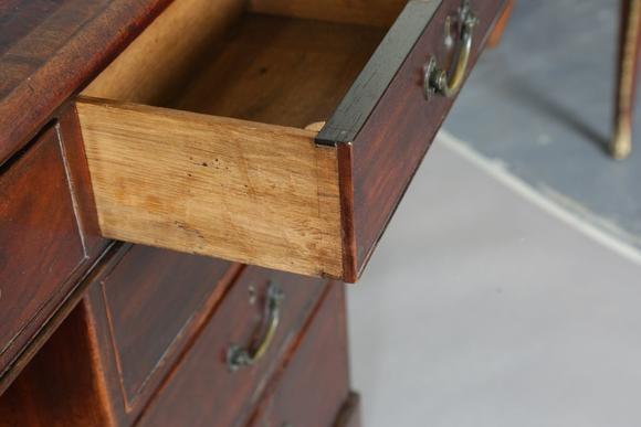TooveysA good late George III mahogany twin-pedestal desk, in the manner of