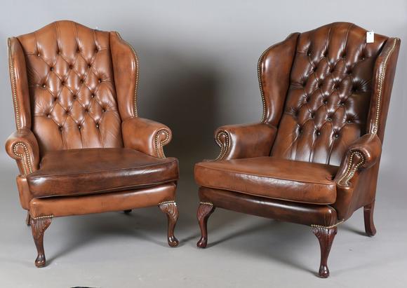 TooveysA pair of late 20th century George III style wing back armchairs, up