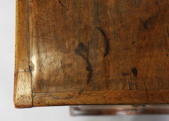 TooveysA George I walnut chest of oak-lined drawers with feather banded bor