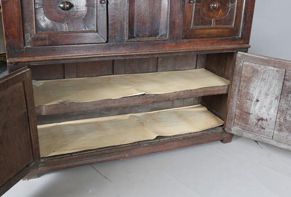 TooveysA 17th century oak side cupboard, fitted with four panelled doors, h